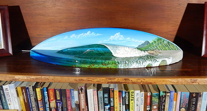 Surfing lamp artwork thar featiures a 3D resin wave and a hand painted tropical back ground. Deep resin pour ocean with a dolphin chasing fish